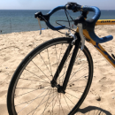 A yellow bike on the beach