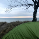 A green tent on the beach