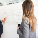 Someone teaching someone else code